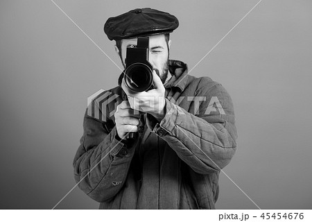 Concept - cinema industry. Cameraman, retro camera Concept - cinema industry. Cameraman, retro camera 45454676