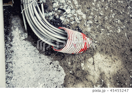 a large set of wires out of the hole in the pipe a large set of wires out of the hole in the pipe 45455247