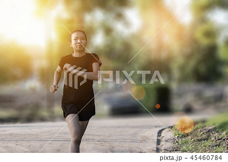 Runner woman running in the garden Runner woman running in the garden 45460784