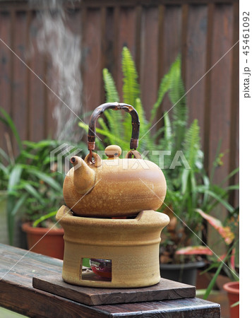 Old kettle put on a fireplace Old kettle put on a fireplace 45461092