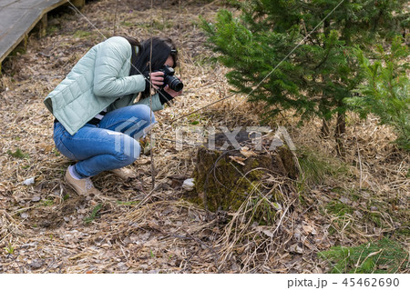 A girl taking pictures 45462690