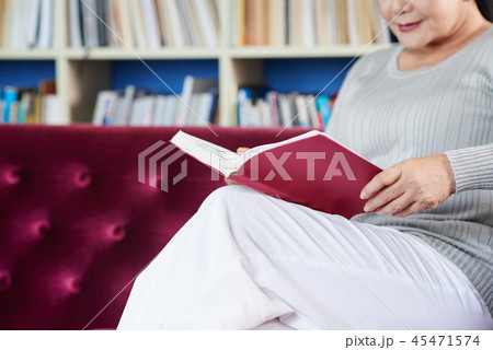 Senior woman enjoying novel 45471574