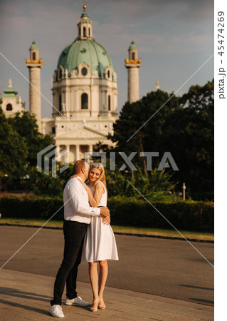 Happy couple walking around the city by the park Black and white clothes 45474269