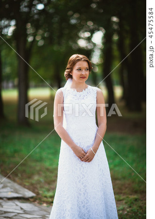 portrait of a young bride on the background park portrait of a young bride on the background park 45475584