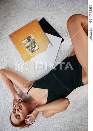 the image of resting sexy woman listening to vinyl the image of resting sexy woman listening to vinyl 45475869