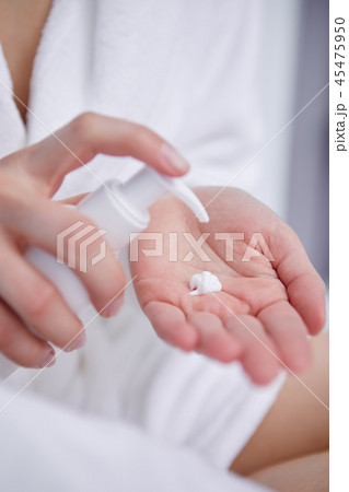 Cream on the women hand. 45475950