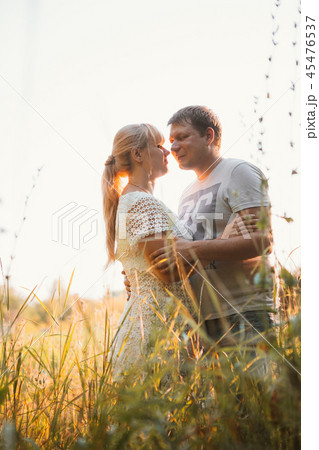 love story man and woman on the background field love story man and woman on the background field 45476537