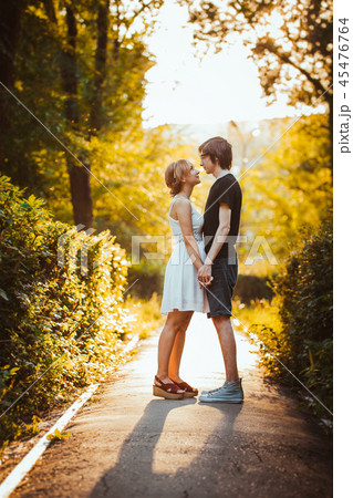 guy and the girl embracing on a background of park 45476764