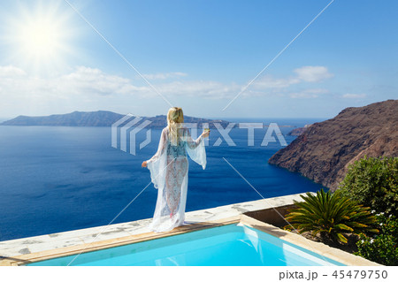 Beautiful woman by the sea 45479750