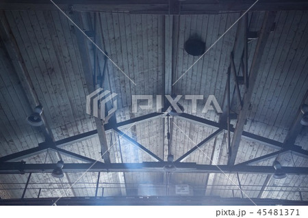 Interior view of a wooden roof structure with lamps. Interior view of a wooden roof structure with lamps. 45481371