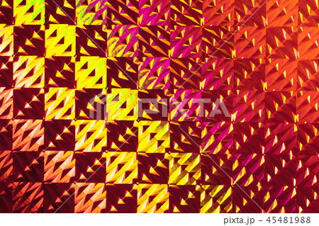 Texture of red foil with holographic effect. Christmas background. 45481988