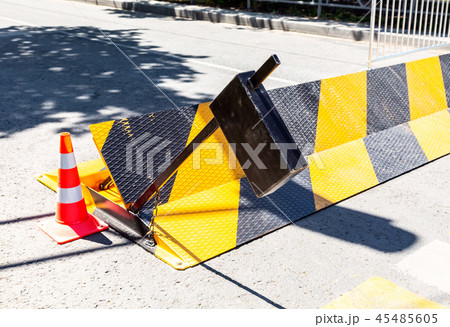 Road barrier with yellow and black striped Road barrier with yellow and black striped 45485605