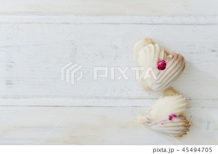 Couple of cookies on white wooden board. Heart shape. Valentine conception. 45494705