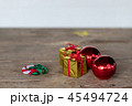 Christmas gift box ribbon redon wooden table 45494724