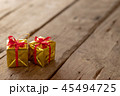 Christmas gift box ribbon redon wooden table 45494725