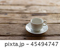 cup of coffee on a wooden table in the morning 45494747