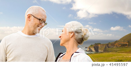 happy senior couple over big sur coast 45495597