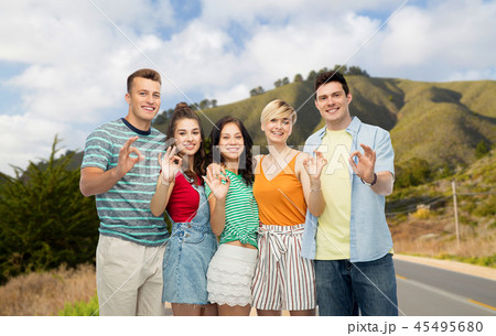 friends showing ok over big sur hills and road 45495680