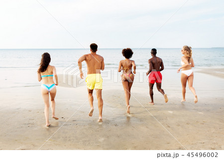 happy friends running on summer beach 45496002