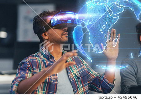 man in vr headset with earth hologram at office 45496046