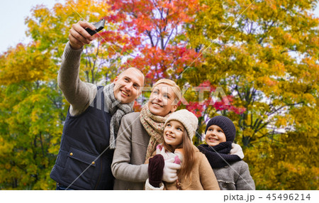 family taking selfie by smartphone in autumn park 45496214