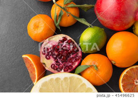 close up of citrus fruits on stone table close up of citrus fruits on stone table 45496625
