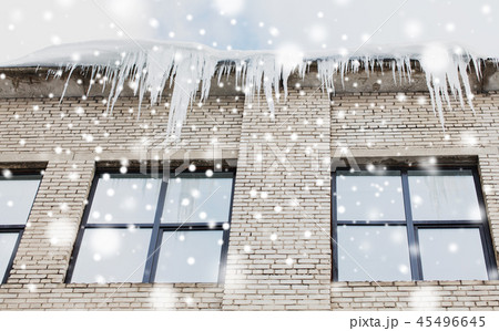 icicles on building or living house facade 45496645