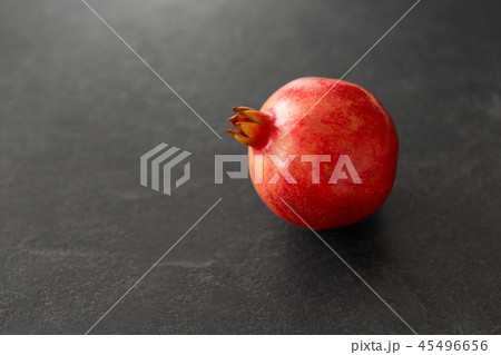 close up of pomegranate on stone table 45496656