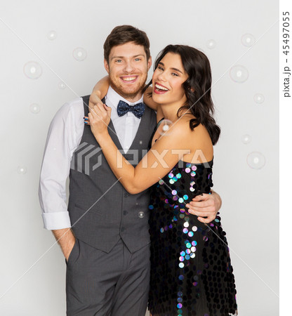 happy couple hugging in soap bubbles at party 45497055