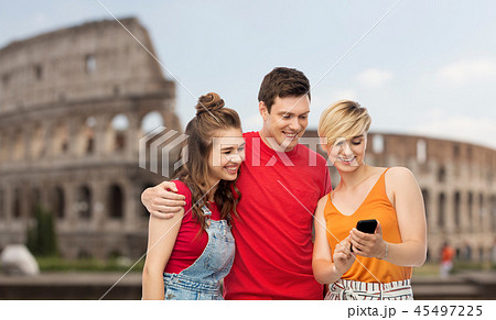 friends with smartphone over coliseum background 45497225