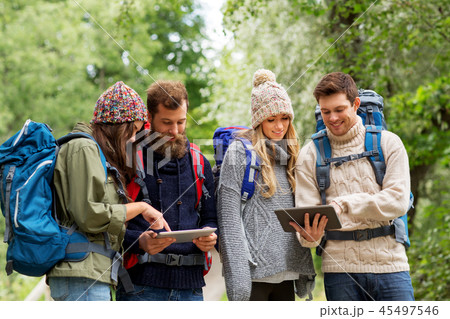 friends or travelers with backpacks and tablet pc friends or travelers with backpacks and tablet pc 45497546