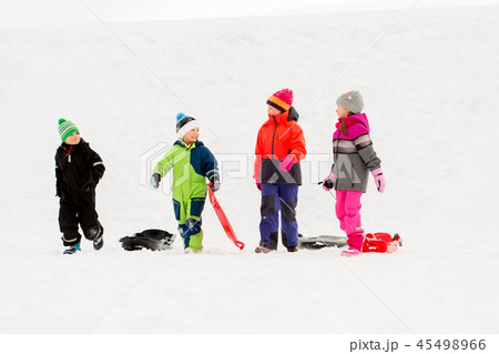 happy little kids with sleds in winter 45498966