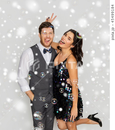 happy couple hugging in soap bubbles at party happy couple hugging in soap bubbles at party 45499184