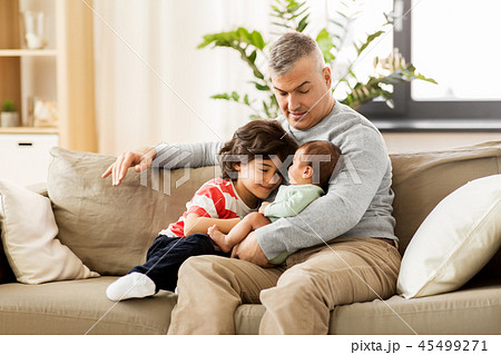 happy father with preteen and baby son at home 45499271