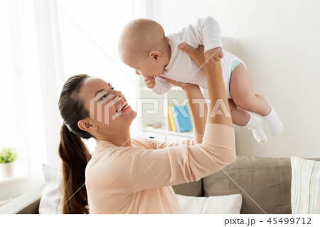 happy mother playing with little baby boy at home happy mother playing with little baby boy at home 45499712