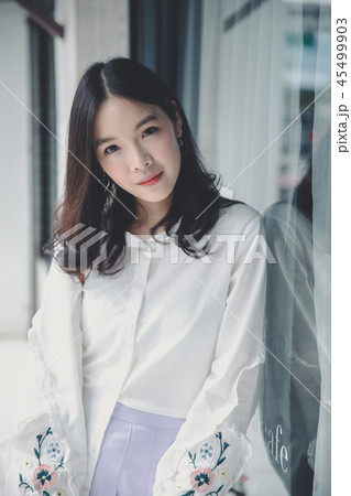 Portrait young woman thinking and looking modern style in outdoor urban background Portrait young woman thinking and looking modern style in outdoor urban background 45499903