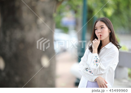 Portrait young woman thinking and looking modern style in outdoor urban background 45499960
