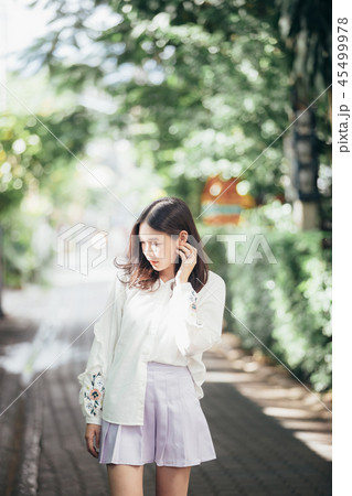 Portrait young woman thinking and looking modern style in outdoor urban background Portrait young woman thinking and looking modern style in outdoor urban background 45499978