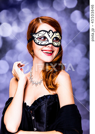 Style redhead girl in dark dress and mask Style redhead girl in dark dress and mask 45503646