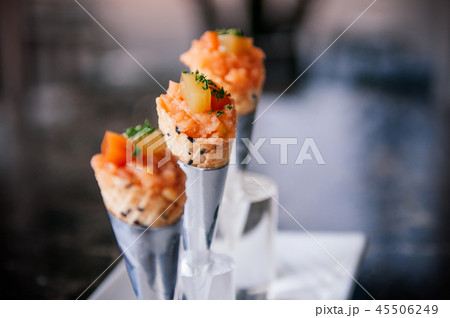 Salmon Tartare in mini waffle cones modern cuisine 45506249