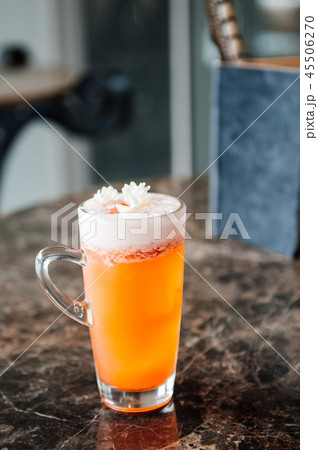 Jasmine tea orange cocktail with fluffy foam 45506270