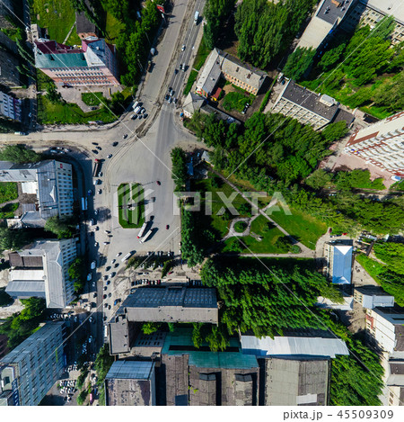 Aerial city view with crossroads and roads, houses buildings. Copter shot. Panoramic image. Aerial city view with crossroads and roads, houses buildings. Copter shot. Panoramic image. 45509309