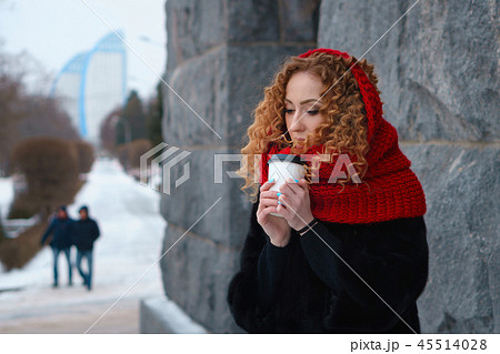 Red-haired girl outdoors in winter Red-haired girl outdoors in winter 45514028