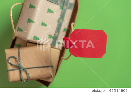 Blank paper note on a bag with Christmas gifts.  45514605