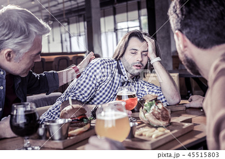 Drunk young man leaning on his arm Drunk young man leaning on his arm 45515803