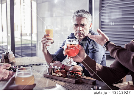Sad mature man communicating with his friends 45515927