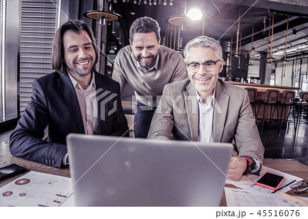 Positive delighted office workers watching business conference 45516076