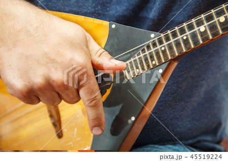 man playing the balalaika. hands closeup 45519224