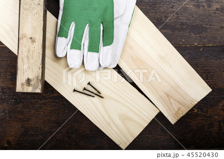 Work gloves on planks 45520430