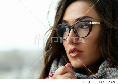 Young beautiful woman in a scarf portrait is 45521569